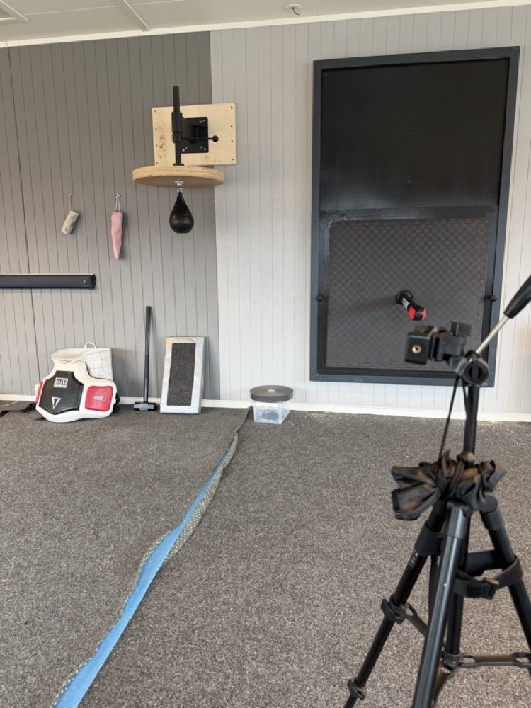 Equipment wall with TV and speed bag